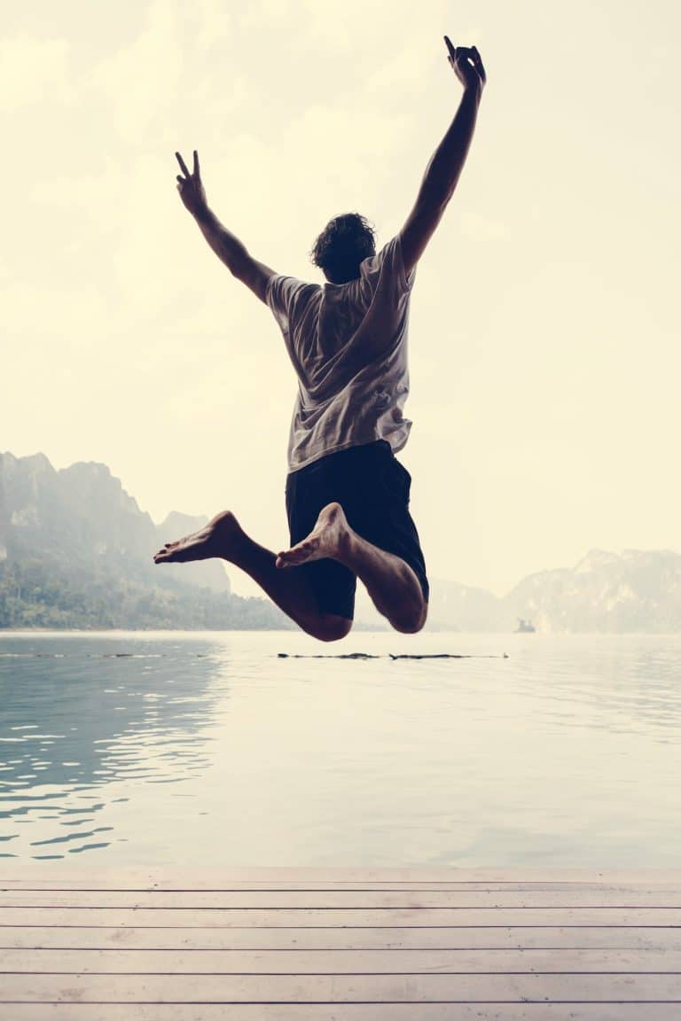 Happy man jumping with joy